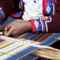 Peruvian-Indian-Woman-in-Traditional-Dress-Weaving