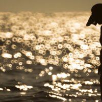 busan-beach-swimmer-hat-water-sunset