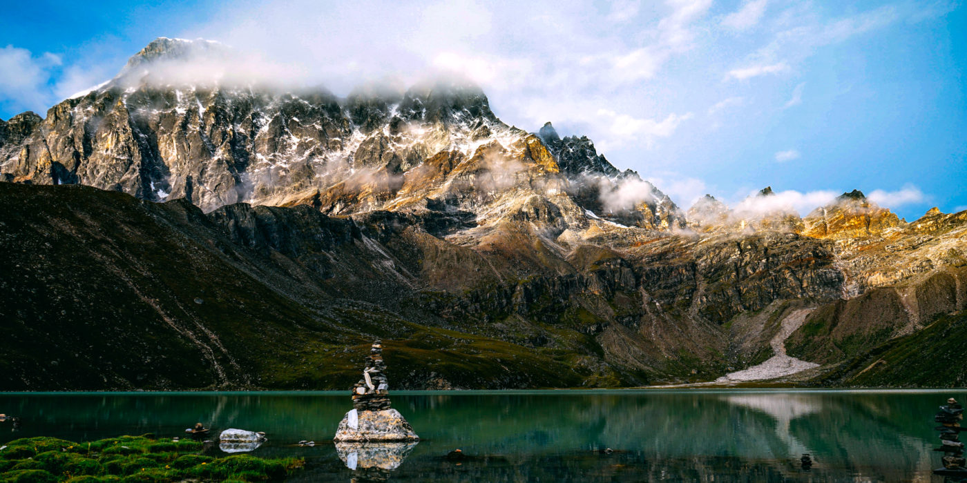 rock-stack-meditation-lake-mountains-nepal-tour